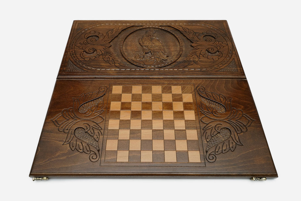 Perched eagle with folded wings hand-carved in wood - backgammon board detail