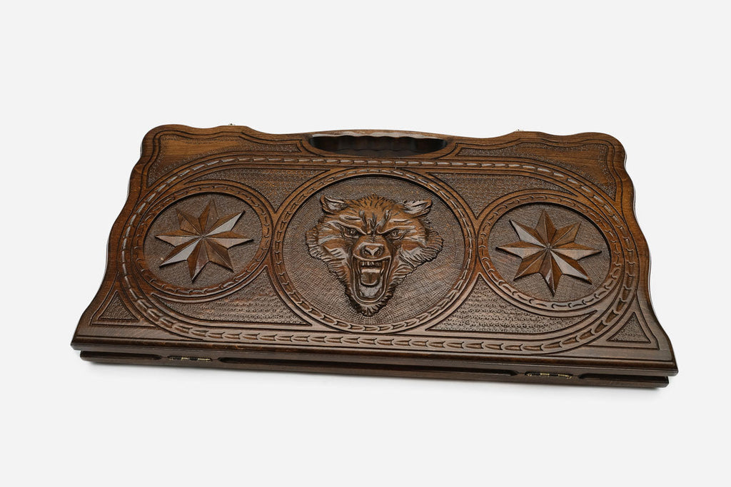 The backgammon board opened to show the wooden playing surface