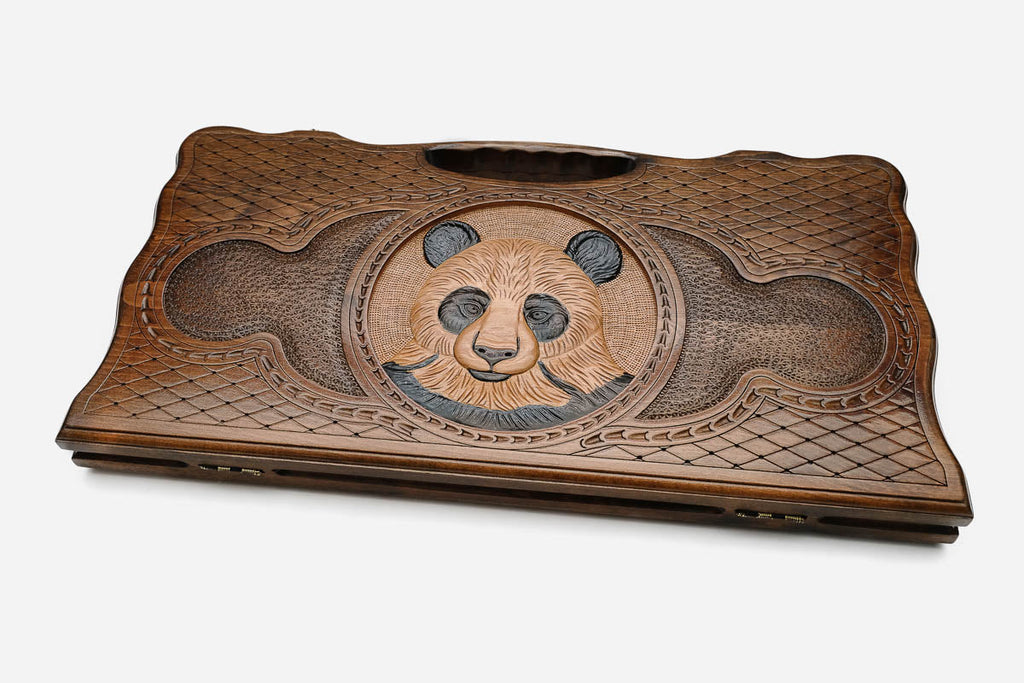 The backgammon board opened to show the wooden playing surface