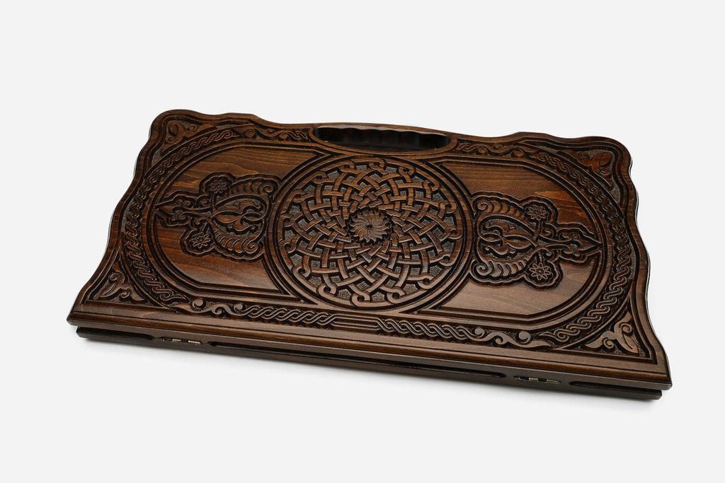 The backgammon board opened to show the wooden playing surface