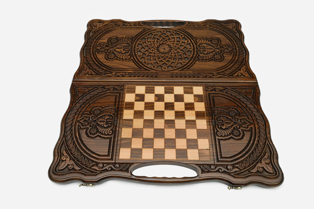Angled view of the twin interlace carved backgammon board