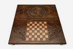 Leaping deer with antlers laid back hand-carved in wood - backgammon board detail