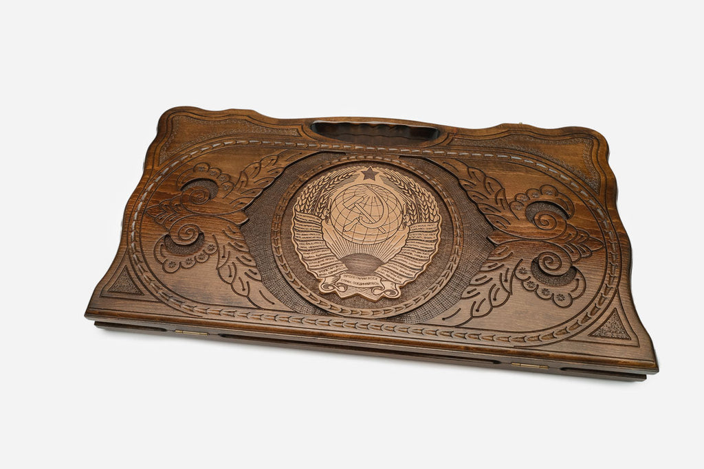 The backgammon board opened to show the wooden playing surface