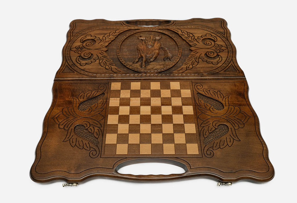 Angled view of the hand-carved ox backgammon set showing the whole lid