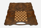 Angled view of the hand-carved ox backgammon set showing the whole lid