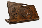 Hand-carved wooden backgammon board with an ox and a cut-out carry handle, propped open