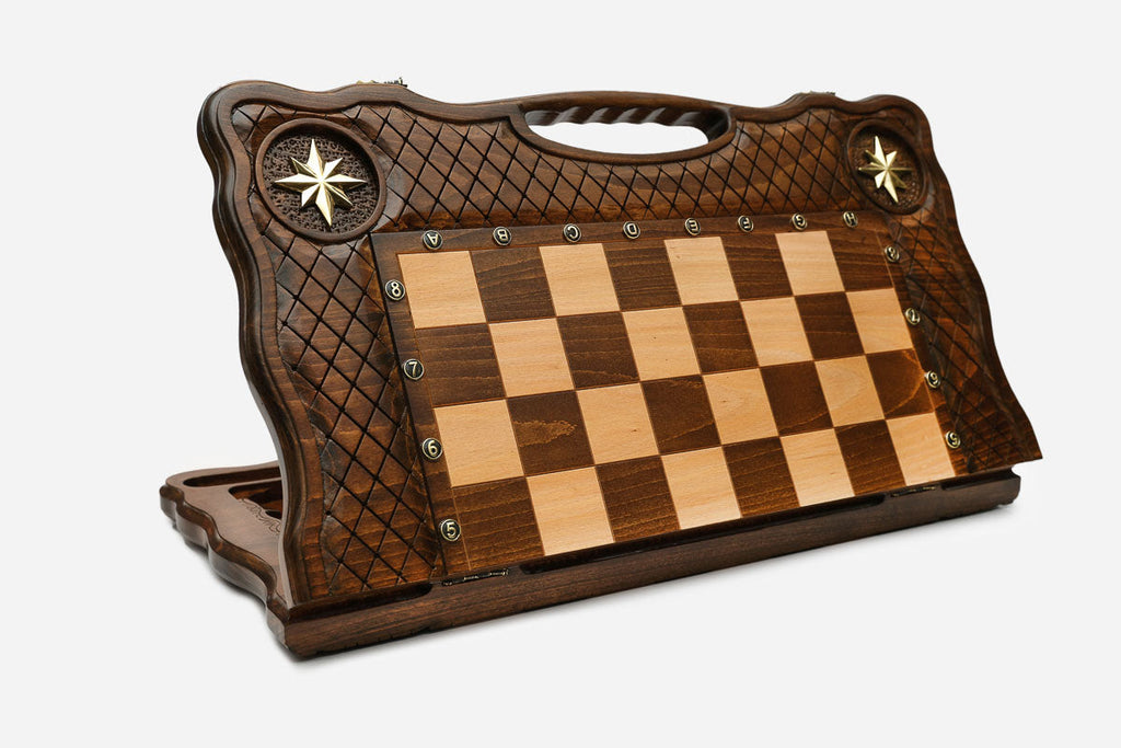 Angled view of the brass star chess board with its bronze figural army
