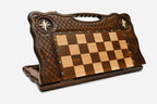 Angled view of the brass star chess board with its bronze figural army