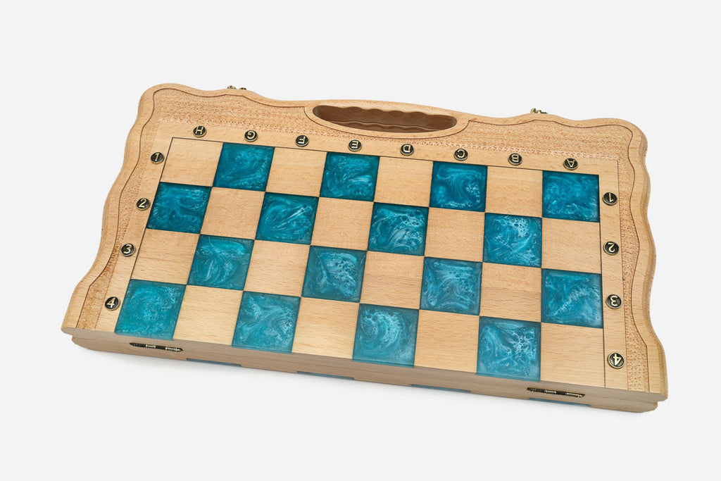 The turquoise epoxy chess set shown from an angle
