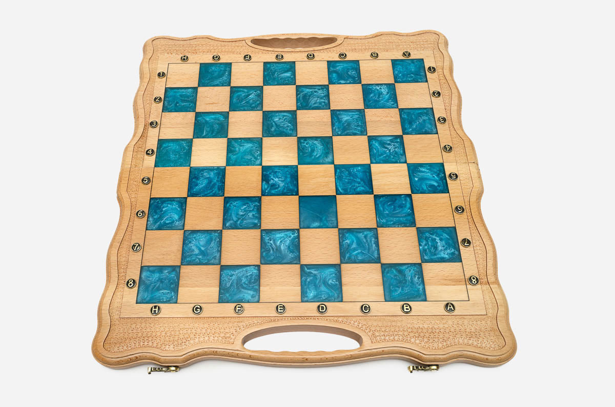 Close-up of the ornately carved walnut and beech chess pieces