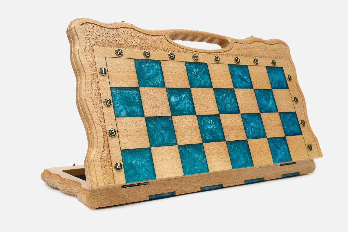 Overhead view of the turquoise epoxy board and full set of pieces