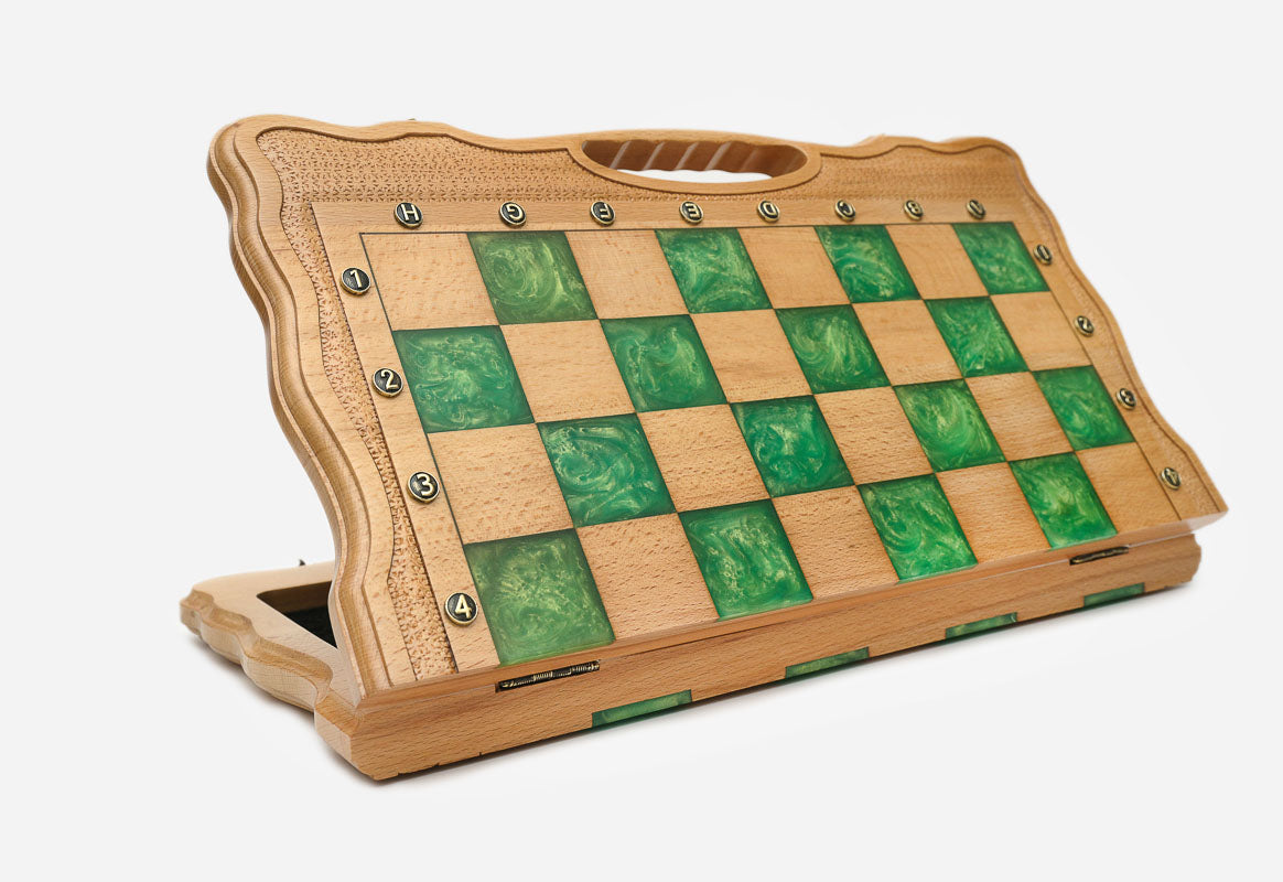 Angled view of the folding green epoxy chess board with its bronze warrior army