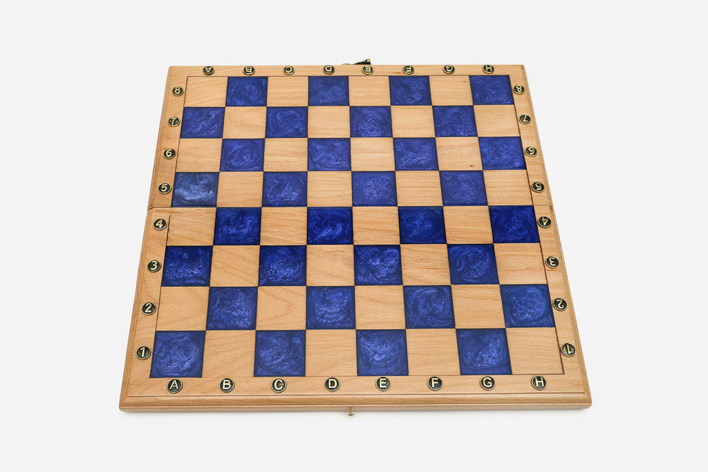 Overhead view of the blue epoxy board and full set of pieces