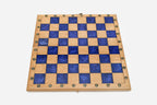 Overhead view of the blue epoxy board and full set of pieces