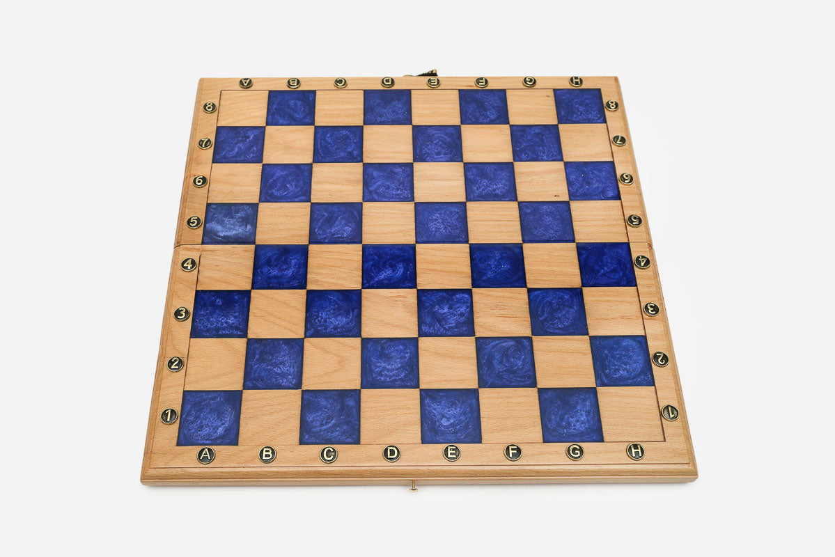 Overhead view of the blue epoxy board and full set of pieces