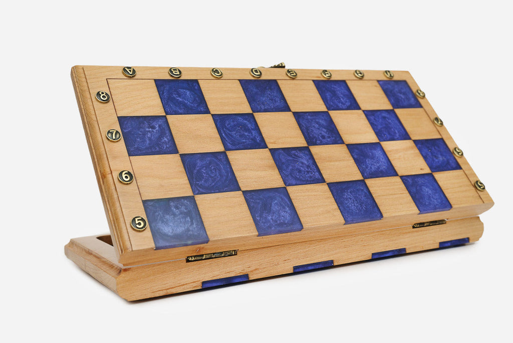 Angled view of the small blue epoxy chess set