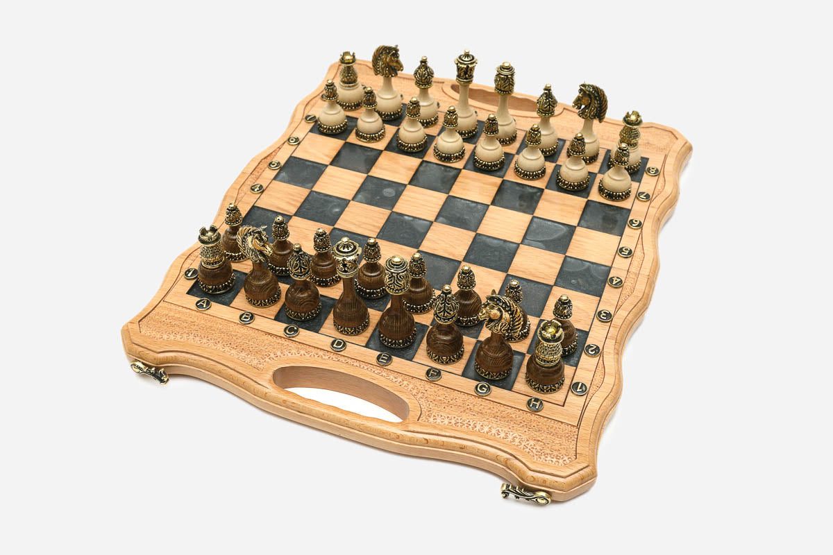 Angled view of the gray epoxy chess set with its bronze pieces