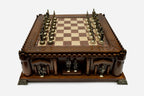 Castle chess set with bronze pieces facing off in starting position, front view