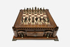 Castle chess set set up for play with bronze pieces, front angled view