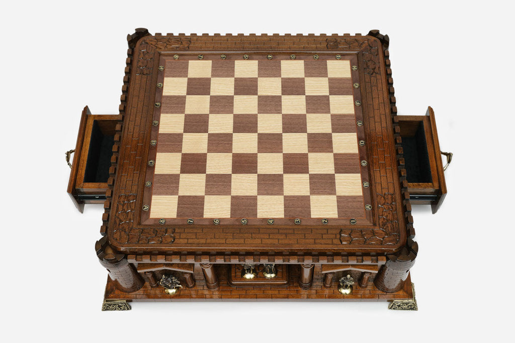 Castle chess set with both side drawers open, empty board, top-down view