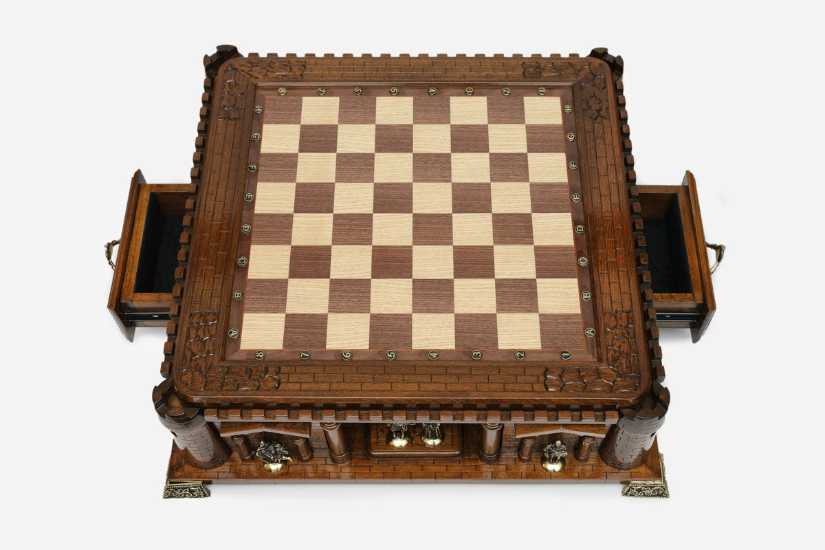 Castle chess set with both side drawers open, empty board, top-down view