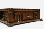 Close-up of the castle chess set side wall with the carved drawer front and knight statues