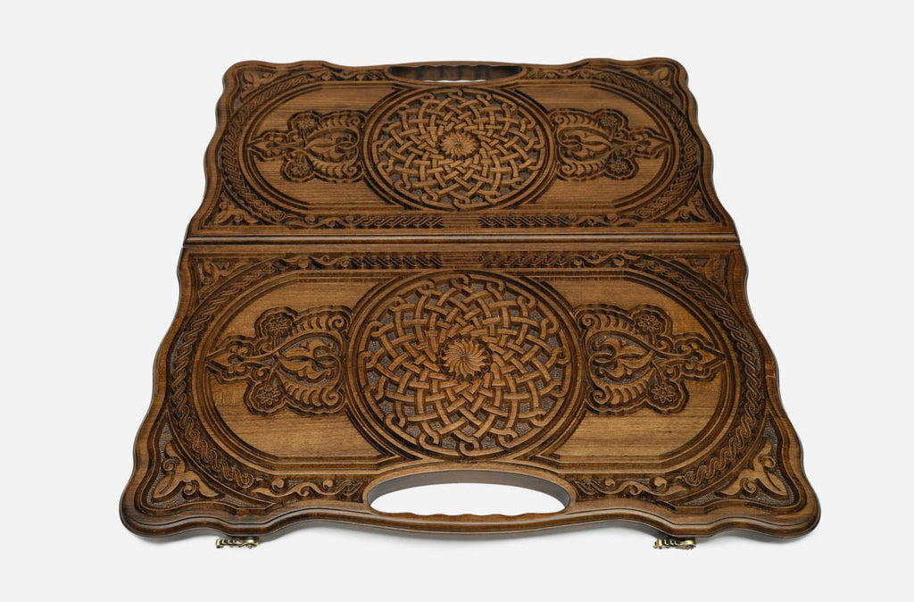 Angled view of the luxury Armenian backgammon set showing both carved ornaments