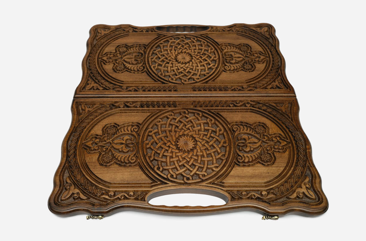 Angled view of the luxury Armenian backgammon set showing both carved ornaments