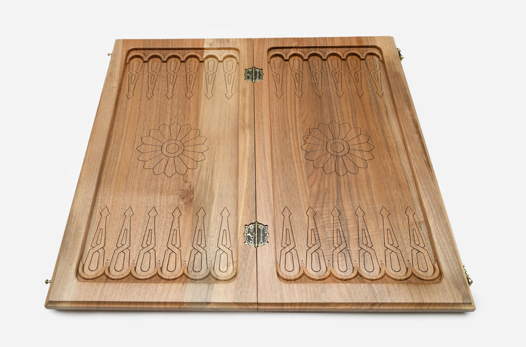 Handmade carpet fragments on a luxury walnut Armenian backgammon set