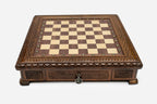 Carved chess set empty board, front view with the drawer closed