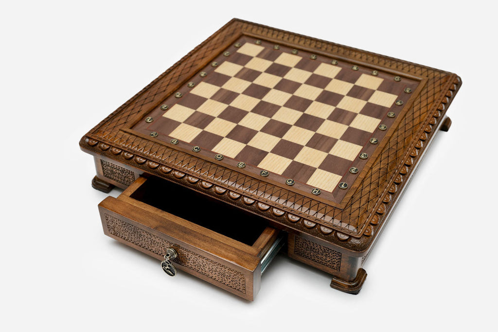 Carved chess set empty board with the drawer open, angled view showing the beaded edge