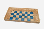 The large blue epoxy chess set shown from an angle