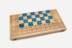 Close-up of the brass coordinate markers around the board