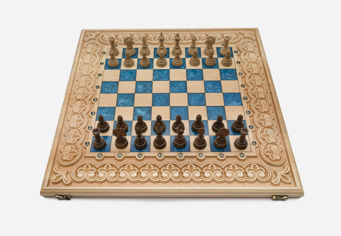 Angled view of the blue epoxy chess set with its wooden pieces