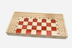 The large red epoxy chess set shown from an angle