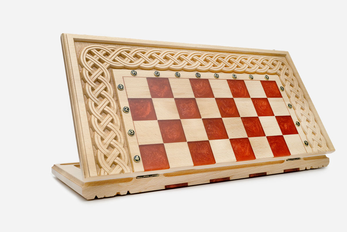 Overhead view of the red epoxy board and full set of pieces