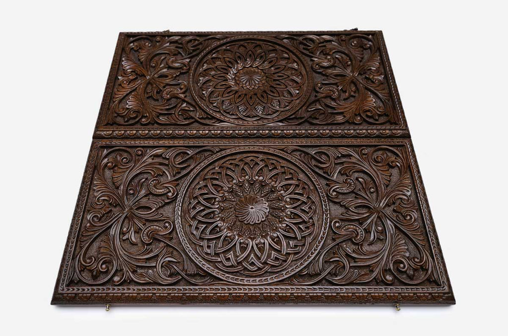 Side view of the closed carved case showing the depth of the relief