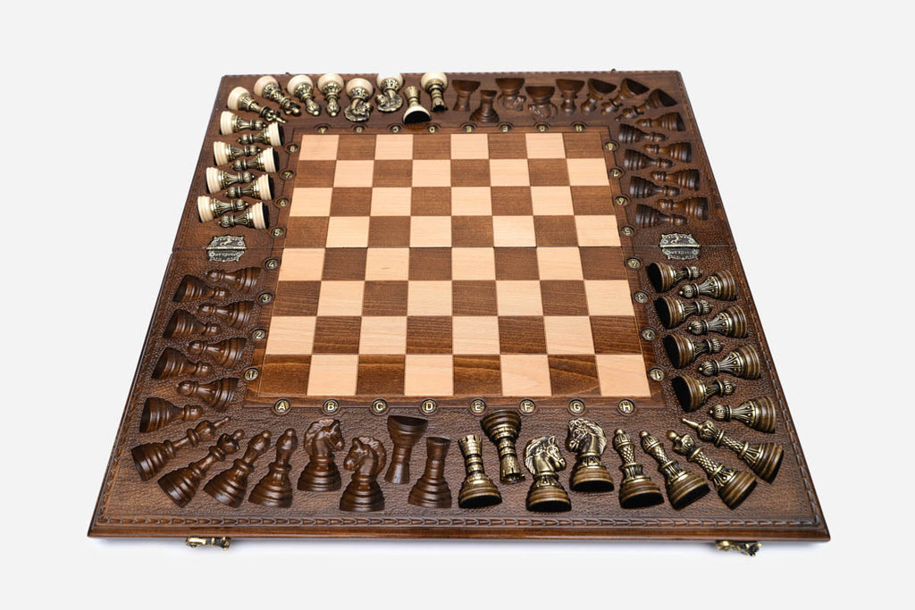Detail of the deep scrollwork carving framing the chess board