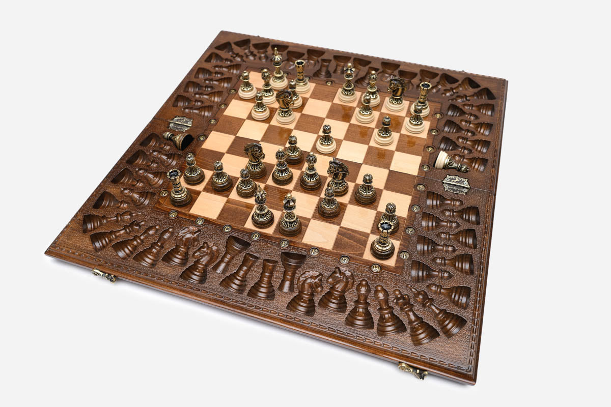 Overhead view of the full bronze and cream chess army on the inlaid 60 cm board