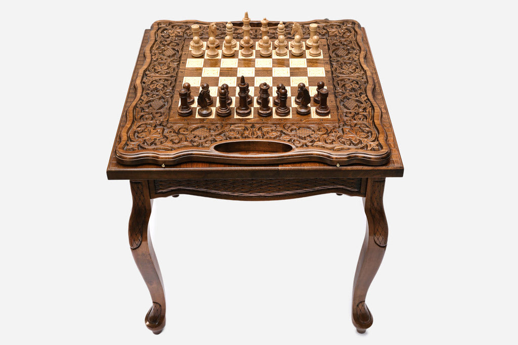 Castle tower chess and backgammon table set up for chess, angled view
