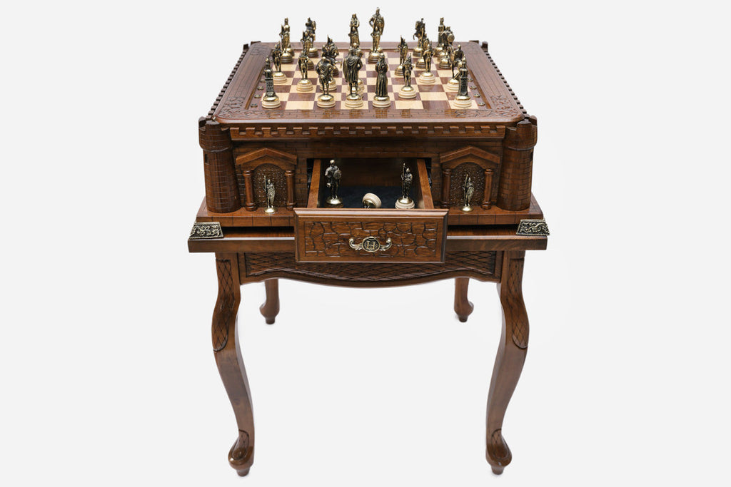 Castle tower game table with chess pieces set up and the drawer open