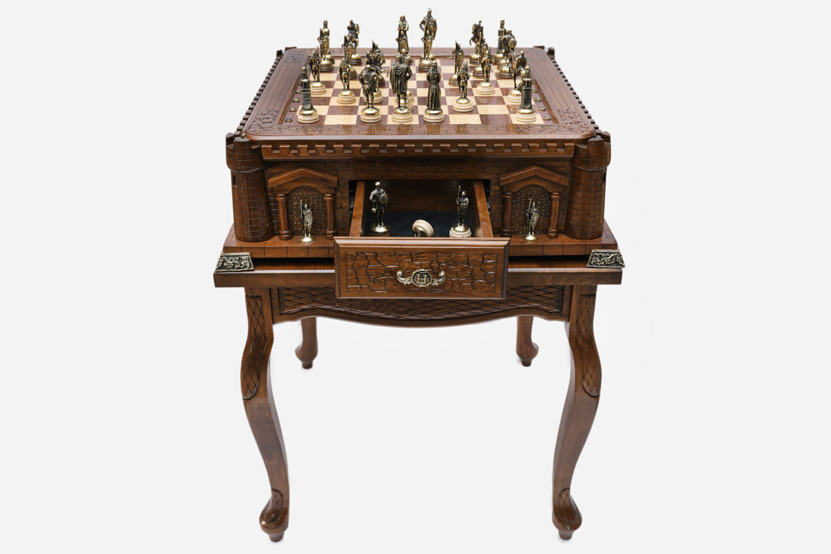 Castle tower game table with chess pieces set up and the drawer open