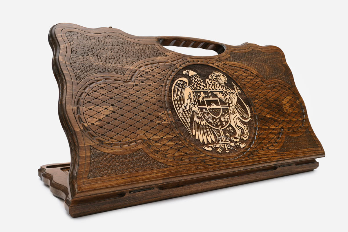 Carved Armenian backgammon board with the coat of arms of Armenia in bronze and a cut-out carry handle, propped open