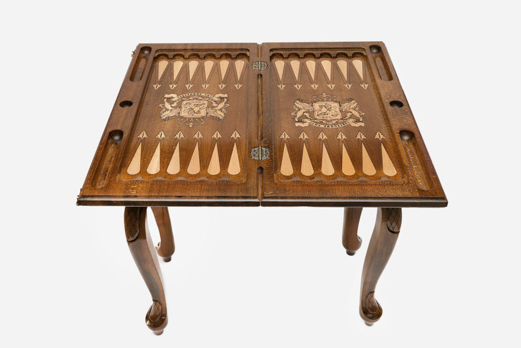 Close-up of the carved leg and drawer front with the Georgian coat of arms