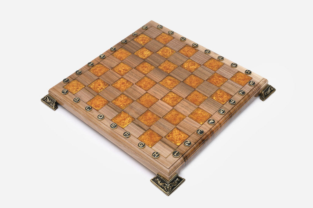 Close-up of the figural bronze warrior and column pieces on the orange epoxy squares