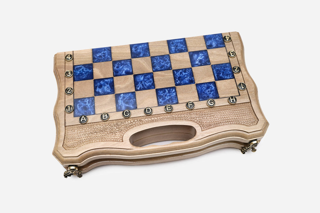 The compact blue epoxy chess set shown from an angle