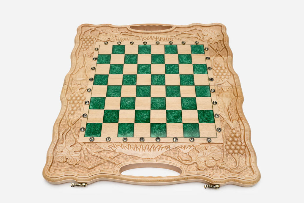 Close-up of the beech and walnut chess pieces on the green epoxy squares