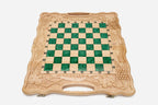 Close-up of the beech and walnut chess pieces on the green epoxy squares
