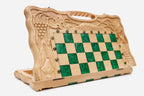 Overhead view of the green epoxy board and full set of pieces