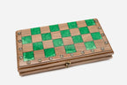 Close-up of the beech and walnut chess pieces on the green epoxy squares